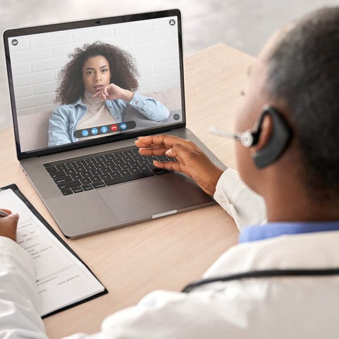 a doctor using a laptop