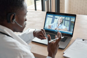 doctor talking to patient on laptop about how to get a second opinion on neurology