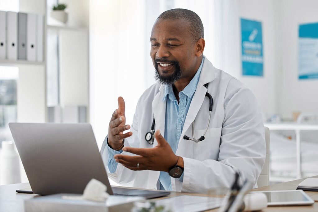 doctor talking with patient on laptop about questions to ask when getting a second opinion