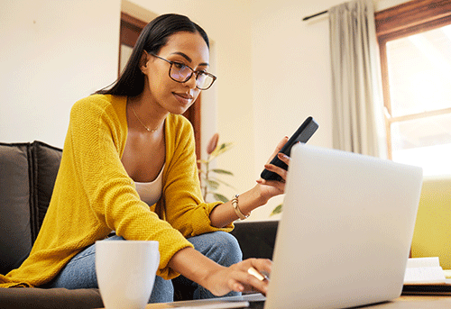 woman on laptop receives a dermatology second opinion