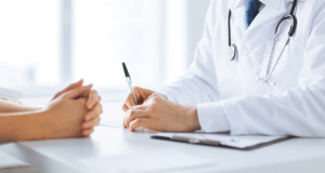 a doctor talks with a patient about Barriers to Getting a Second Medical Opinion